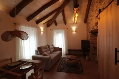 a living room with a couch and a table at Casa Fente in Taboada