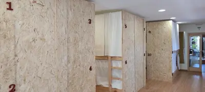 a room with a wall with wooden dividers at HOSTEL NAMOR in Ribadeo