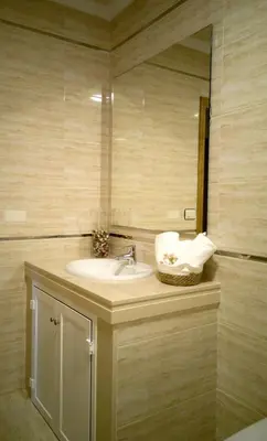 a bathroom with a sink and a mirror at A DE NENO in Melide