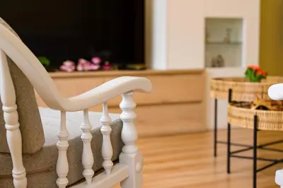 a white staircase with a television in a living room at A DE NENO in Melide