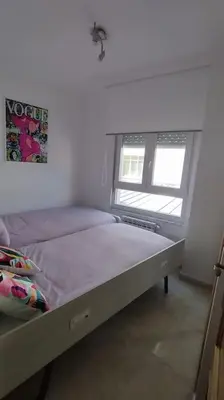a bedroom with a bed and a window in it at Apartamento en Foz. Primera Línea Playa Rapadoira in Foz
