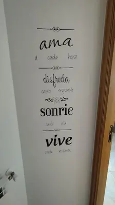 a wall with writing on the wall of a bathroom at Apartamento en Foz. Primera Línea Playa Rapadoira in Foz