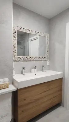 a bathroom with a sink and a mirror at Suite Playa in Miño