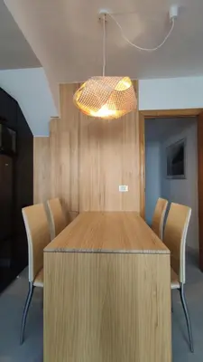 a conference room with a wooden table and chairs at Suite Playa in Miño