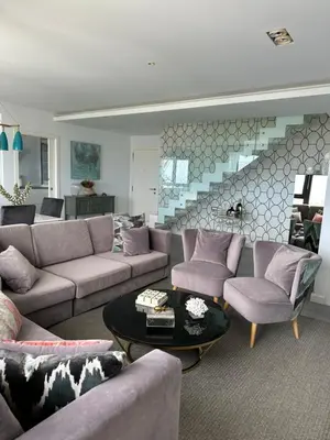 a living room with a couch and chairs and a table at DÚPLEX DE LUJO EN FOZ CON VISTAS al MAR in Foz