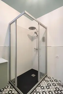 a shower with a glass enclosure in a bathroom at Iria Gardens in Padrón