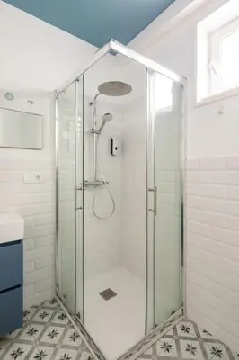 a shower with a glass door in a bathroom at Iria Gardens in Padrón
