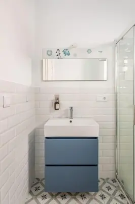 a white bathroom with a sink and a shower at Iria Gardens in Padrón
