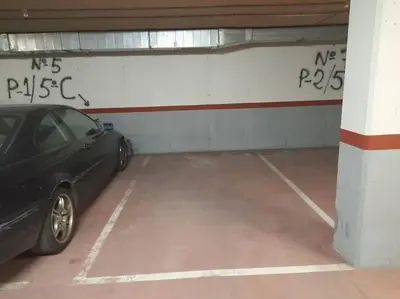 a parking garage with a car parked in it at Precioso apartamento, Pontedeume in Puentedeume