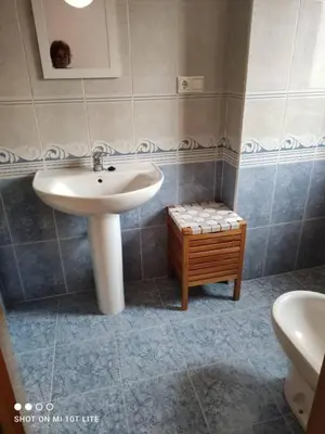 a bathroom with a sink and a toilet and a sink at Precioso apartamento, Pontedeume in Puentedeume