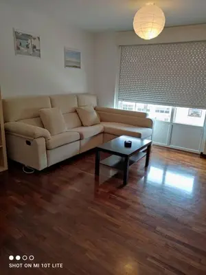 a living room with a couch and a coffee table at Precioso apartamento, Pontedeume in Puentedeume