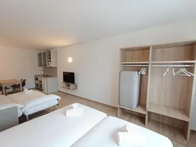 a hospital room with two beds and a tv at Apartamentos Turísticos Pontepedriña by Bossh! Hotels in Santiago de Compostela