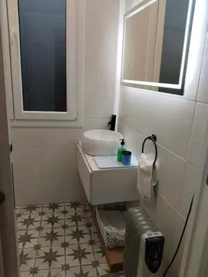 a bathroom with a sink and a mirror at TraviesaBetanzos in Betanzos