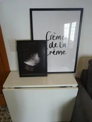 a white dresser with two pictures on top of it at Apartamento foroplaza campo I in Lugo