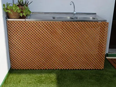 a sink with a faucet and some plants at VUT Corea324 in Caboalles de Abajo