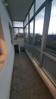 an empty hallway with windows in a building at Piso Ribeira Sacra in Monforte de Lemos