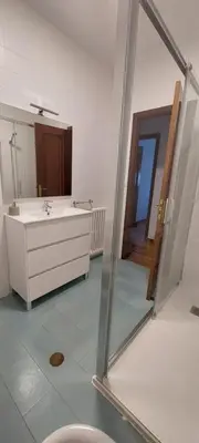 a bathroom with a sink and a mirror at Piso Ribeira Sacra in Monforte de Lemos