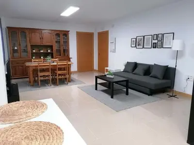 a living room with a couch and a table at Lar de Yago - Apto Ribadeo in Ribadeo