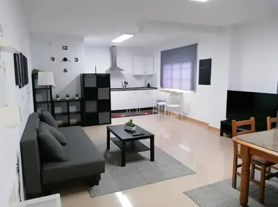 a living room with a couch and a table at Lar de Yago - Apto Ribadeo in Ribadeo