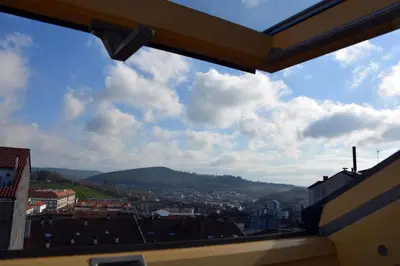 a view of a city from a window at HHC - Duplex Concheiros, 4 bedrooms, 3 bathroom, a 700m de la Catedral in Santiago de Compostela