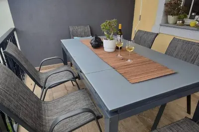 a blue table with two glasses of wine at Preciosa casa en Ribadeo in Ribadeo