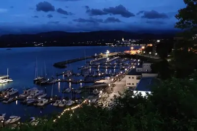 a marina with boats in the water at night at Preciosa casa en Ribadeo in Ribadeo