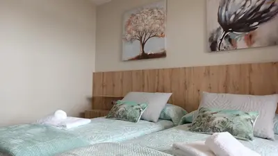 two beds sitting next to each other in a bedroom at SALSEIRAZO - PLAYA A RIBEIRA MIÑO in Miño