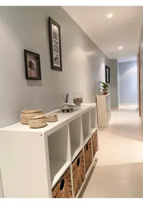 a hallway with a white counter in a house at Gran vía in Ribadeo