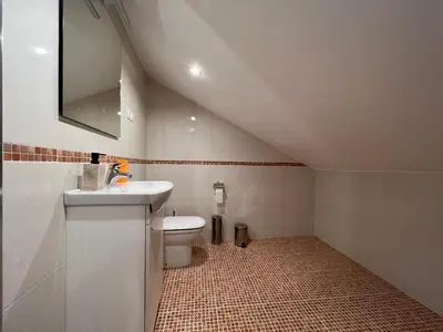 a bathroom with a sink and a toilet at Vagalume in Cervo