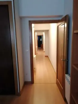 a hallway with a hallway leading into a room with at Casa do Cervo - San Cibrao in San Ciprián