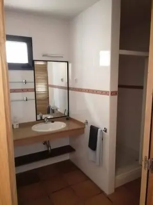 a bathroom with a sink and a mirror at Casa do Cervo - San Cibrao in San Ciprián