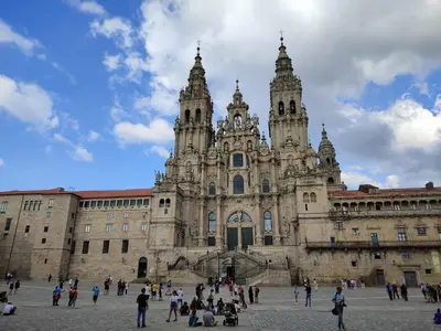 a large building with people standing in front of it at Albergue SP 55 by Bossh! Hotels in Santiago de Compostela