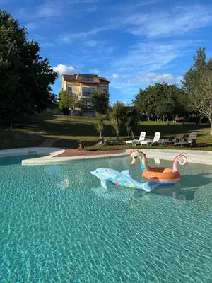 a swimming pool with two toys in the water at Casa da Rapadoira in Laxoso de Abaixo