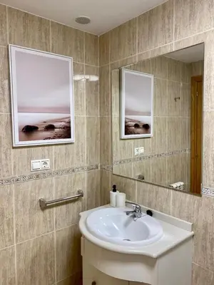 a bathroom with a sink and a mirror at Andainas C in Milladoiro
