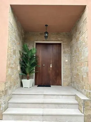 a wooden door with a plant in front of it at Excepcional chalet en Perbes. in Miño