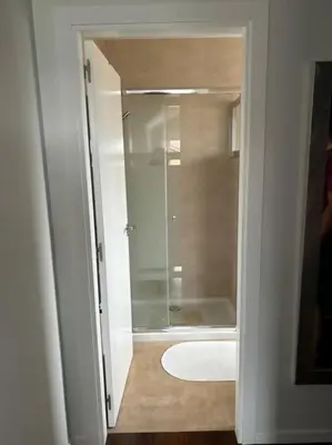 a bathroom with a shower and a bath tub at Excepcional chalet en Perbes. in Miño