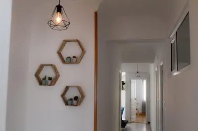 a hallway with three mirrors on the wall at Muralla de Tata in Lugo
