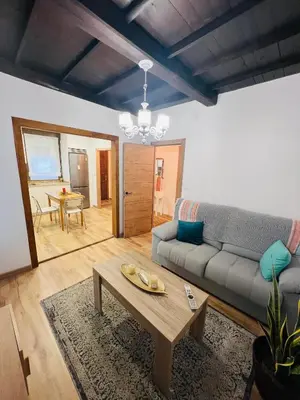 a living room with a couch and a coffee table at A CASA DO LUGAR in Sampaio