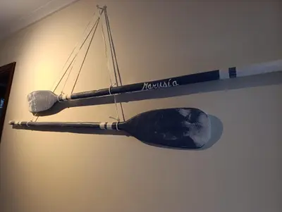 two ping pong paddles hanging on a wall at Marusia in Viveiro