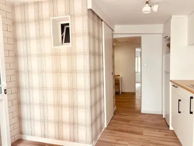 a living room with a plaid wall at Casita típica de pescadores -Casa Gloria- WIFI in Burela de Cabo