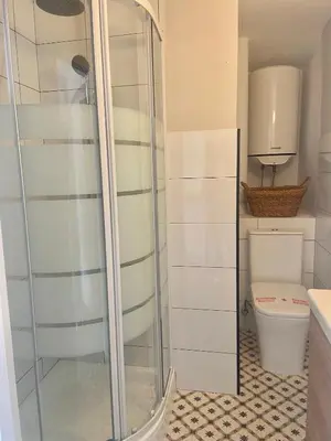 a shower in a bathroom with a toilet at Casita típica de pescadores -Casa Gloria- WIFI in Burela de Cabo