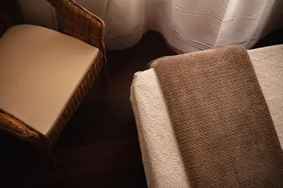 a chair and a table in a room with a bed at Pensión O Camiño in Sarria
