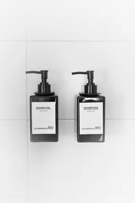 two bottles ofodorizers sitting next to each other at Pensión O Camiño in Sarria