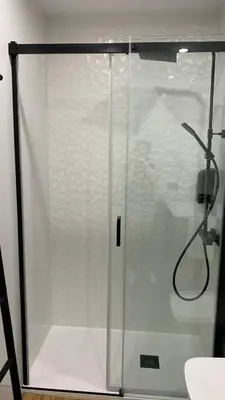 a shower with a glass door in a bathroom at Casa da Alfóndega in Caldas de Reis