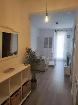 a living room with a sink and a mirror at Casa Dina II. in Carballino