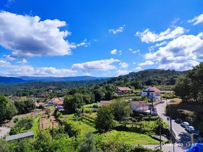 an aerial view of a small town with mountains in the background at Mondariz Donde el Agua es Vida in Mondariz
