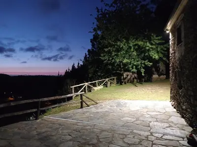 a stone walkway with a fence and a wooden bridge at Casa da Costa de Sueiro in Sueiro