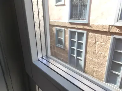 a window with a view of a brick building at 2. Luminoso y único en la mejor zona gastronómica in Ourense