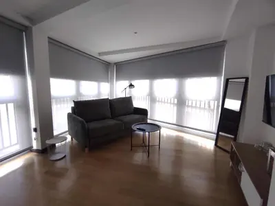 a living room with a couch and a table at 3. Amplio y muy luminoso para disfrutar de Ourense in Ourense