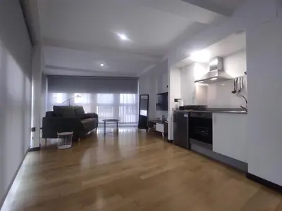 a living room with a couch and a kitchen at 3. Amplio y muy luminoso para disfrutar de Ourense in Ourense